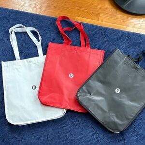 Lululemon shopping Tote Bag Set - Red, Black, White medium size.